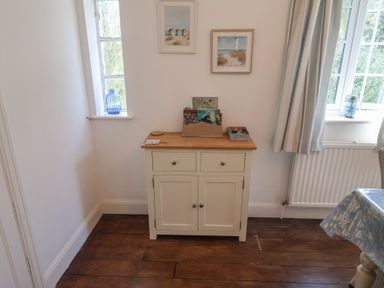 A snug with a cabinet against the wall at High Ground, Reydon