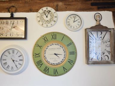 A wall with six clocks of different designs and sizes at Church Farmhouse Cookley Near Halesworth