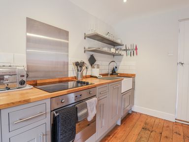 A kitchen with appliances and utensils at Fig Cottage, Pettistree Near Woodbridge