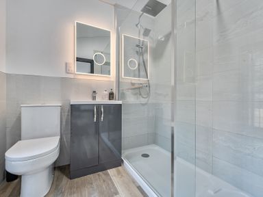 A bathroom with a shower and toilet at The Annex in Wimborne Minster