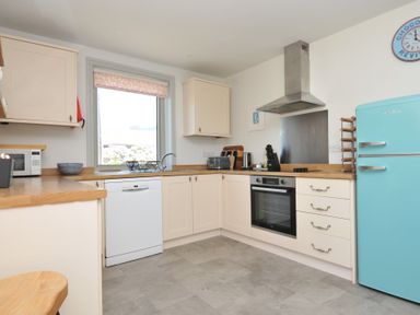 A kitchen with modern appliances at The Lookout in Polzeath