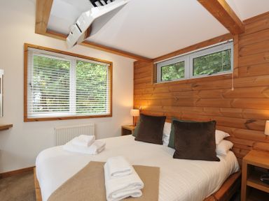 A bedroom with a bed and decorative pillows at 3 Southern Place in Dobwalls