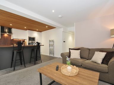 A living room with a sofa and coffee table at 24 Meadow Retreat in Dobwalls