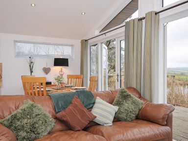 A dining room with a table and chairs at 15 Faraway Fields Dobwalls
