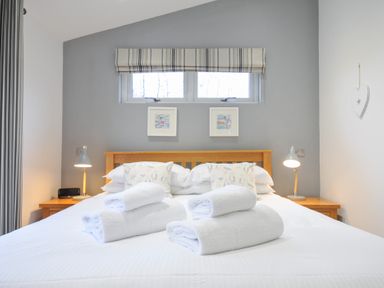A bedroom with a bed and pillows at 15 Faraway Fields in Dobwalls