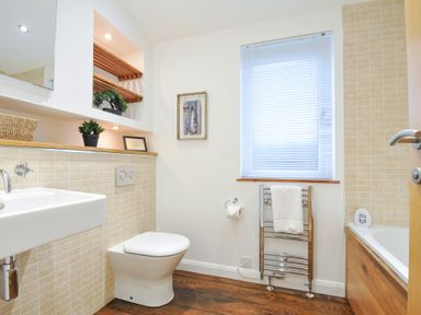 A bathroom with a sink a toilet and a bathtub at 15 Faraway Fields Dobwalls