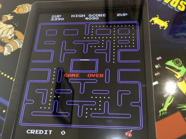 An arcade game screen showing a maze with dots and the text game over at 18 Meadow Retreat in Dobwalls