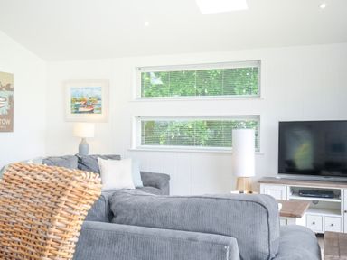 A living room with a sofa and television at 1 Horizon View in Dobwalls