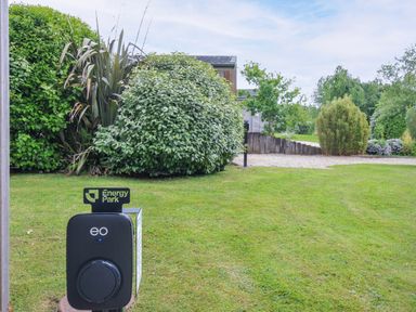 An electric vehicle charger and vegetation in the outdoor area at 1 Horizon View Dobwalls