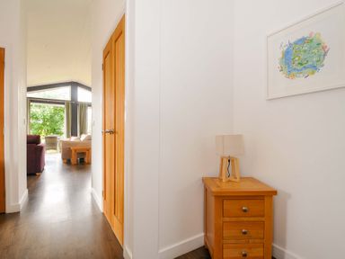 A hallway with a lamp and painting at 3 Horizon View, Dobwalls