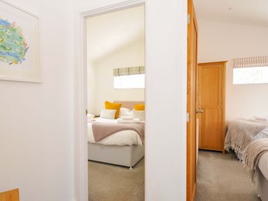 A bedroom with beds and a wardrobe at 3 Horizon View in Dobwalls