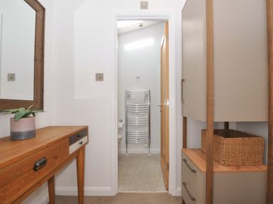 A bathroom with a towel rail and cabinet at 8 Horizon View in Dobwalls