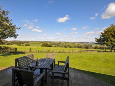 An outdoor seating area with a table and chairs at 8 Horizon View in Dobwalls