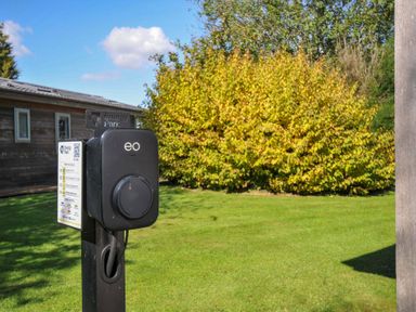 A charging point in a garden area at Energy Park in Dobwalls