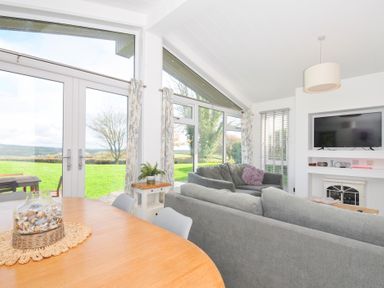 A living room with a sofa and television at 9 Horizon View in Dobwalls