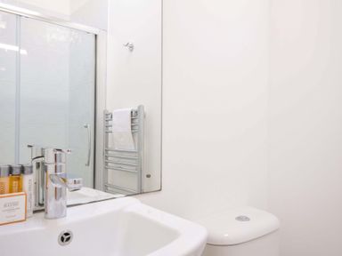 A bathroom with a sink, toilet, and shower at 10 Horizon View in Dobwalls
