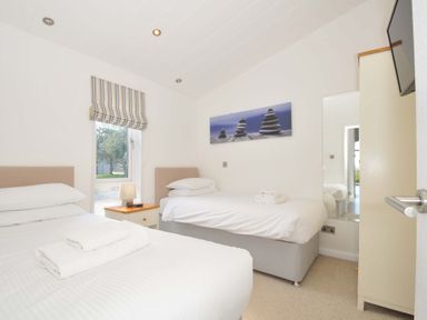 A bedroom with two beds and a window at 10 Horizon View, Dobwalls