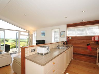 A kitchen with a sink and toaster at 11 Horizon View Dobwalls