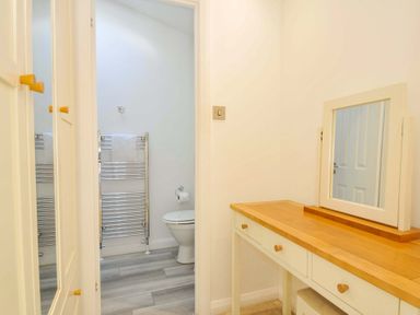 A bathroom with a toilet and a vanity table at 11 Horizon View in Dobwalls