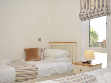A bedroom with beds and a lamp at 11 Horizon View Dobwalls