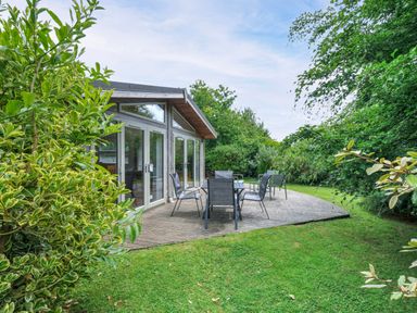 A garden with seating area and greenery at 15 Horizon View in Dobwalls