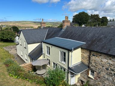 A house with a garden and outdoor seating at Delfryn, Newport