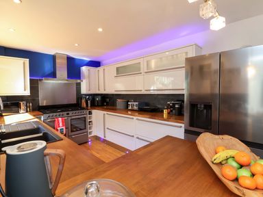 A kitchen with modern appliances and a fruit bowl at Hillsview in Combe Martin