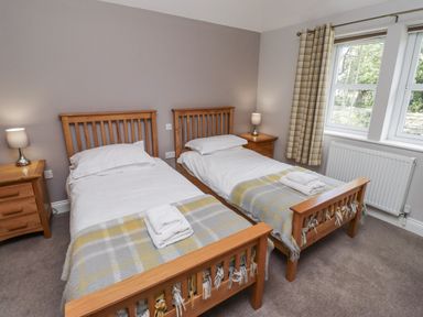 A bedroom with two beds and a window at Crispin in Lucker