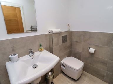 A bathroom with sink and toilet at Farne Cottage Beadnell