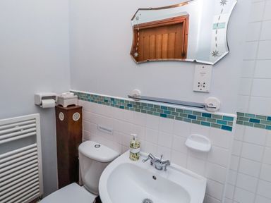 A bathroom with a sink and toilet at No9 Budle Sands in Bamburgh