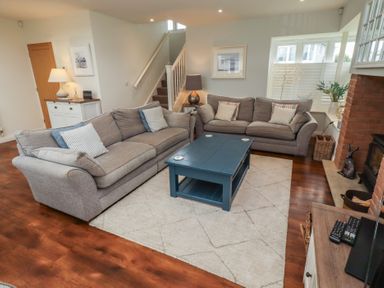 A living room with sofas and a coffee table at The Beach Hut Beadnell