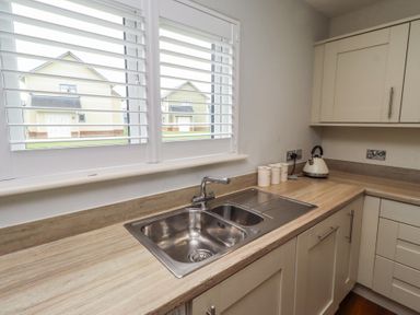 A kitchen with a sink and kettle at The Beach Hut in Beadnell