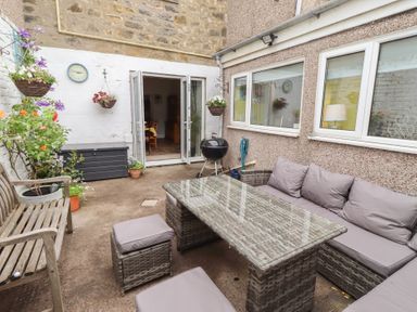 An outdoor area with seating and plants at Number Seventeen Amble
