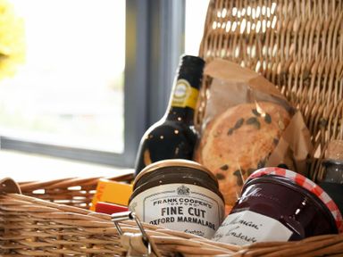 A wicker basket containing jars of marmalade and jam a bottle a loaf of bread at Waters Edge Beadnell Harbour Road in Beadnell