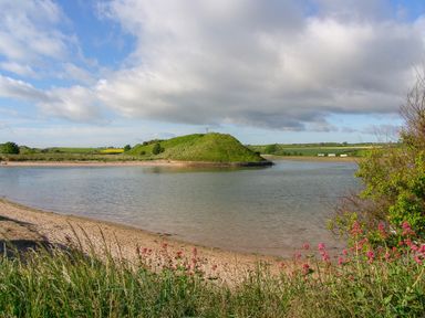 A landscape with water and an island at Percy Cottages No4 Alnmouth