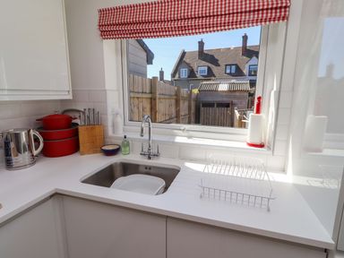 A kitchen with a sink and countertop at Dunford Cottage in Bamburgh