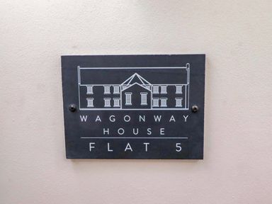 A sign for Wagonway House Flat 5