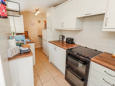 A kitchen with appliances and cabinetry at Hardys House Alnwick