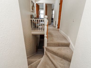 A staircase leading to a hallway at Hardys House in Alnwick