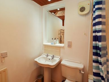 A bathroom with a sink and toilet at Lavender Cottage (Bailiffgate) Alnwick