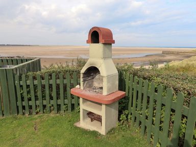 A barbecue grill in an outdoor area at Heather Cottages - Grey Seal Bamburgh