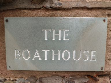 A stone plaque with the words THE BOATHOUSE carved into it at The Boathouse in Seahouses