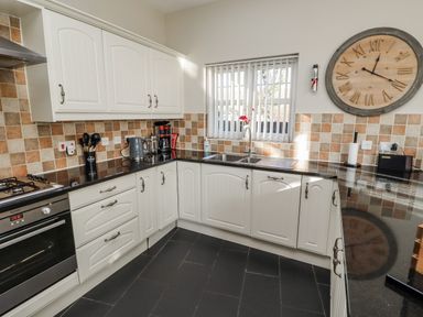 A kitchen with cabinets and appliances at Red Fox in Lucker