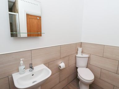 A bathroom with a sink and toilet at Chiff Chaff in Lucker
