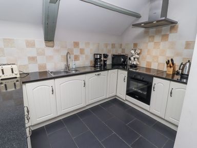 A kitchen with appliances and cabinets at Old Mill (Lucker) in Lucker