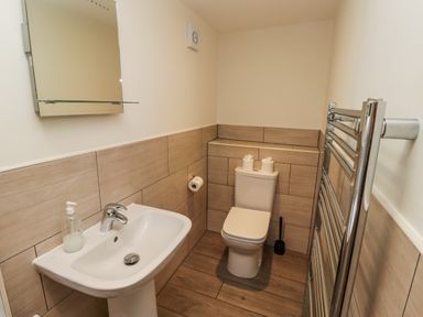 A bathroom with a sink and toilet at Millstone in Lucker