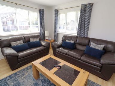 A living room with two sofas and a coffee table at 6 Westview in Embleton