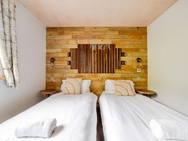 A bedroom with two single beds at Bwncath in Garthmyl