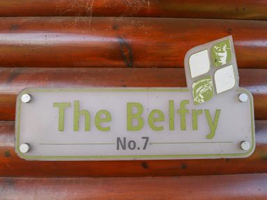 A sign on a wooden wall that reads The Belfry No 7 at Lodge 7 in South Hykeham