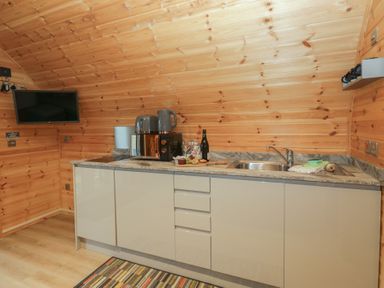 A kitchen with a sink and appliances at Holly in Ulverston